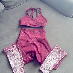 Beyond Yoga sports bra and legging set. Color is maroon-ish